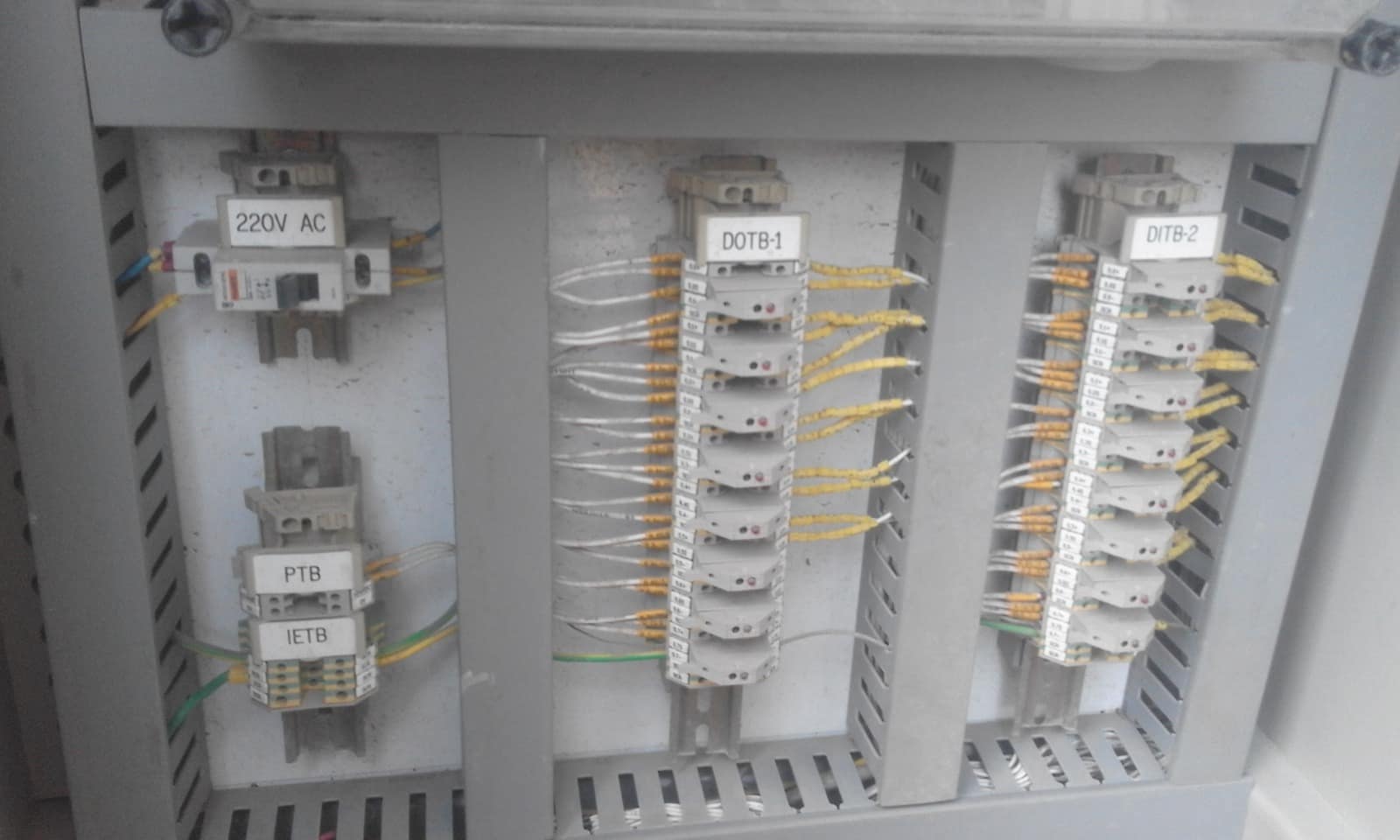 Wiring and terminal connections inside an industrial control cabinet
