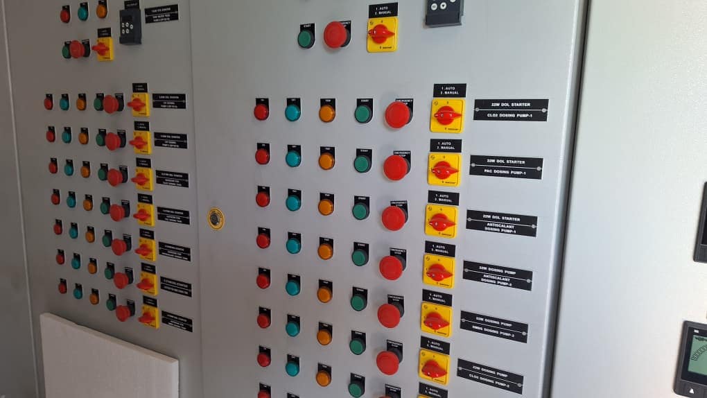 Industrial electrical panel with indicator lights and control switches